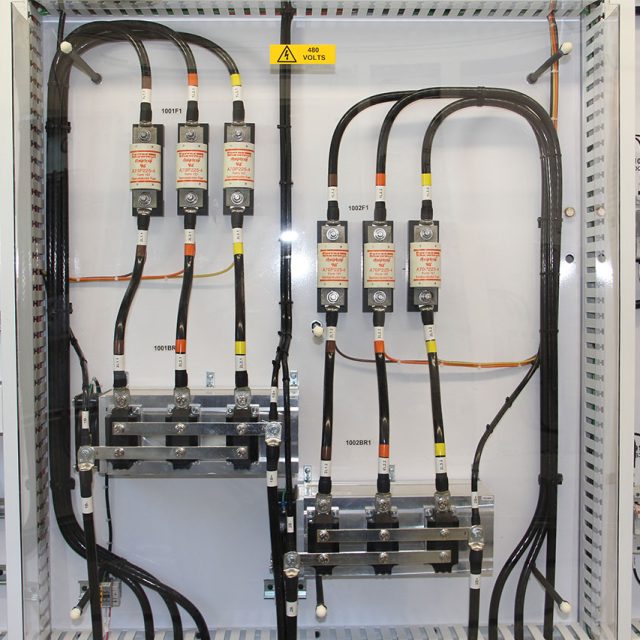 Electrical wires in a control panel within an e-house