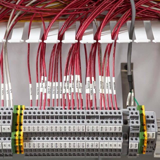 A mass of organized wires in a piece of system integration equipment